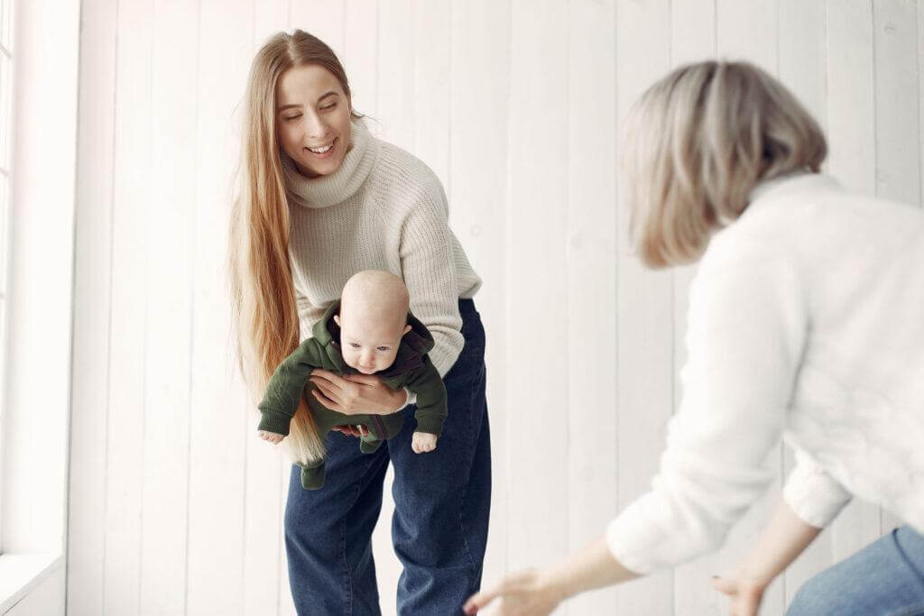 Elegant grandma at home with daughter and granddaughter